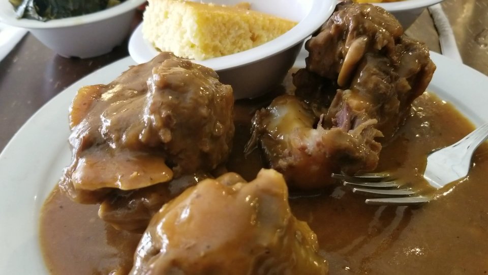 Comfort-food plates in a cozy restaurant setting.